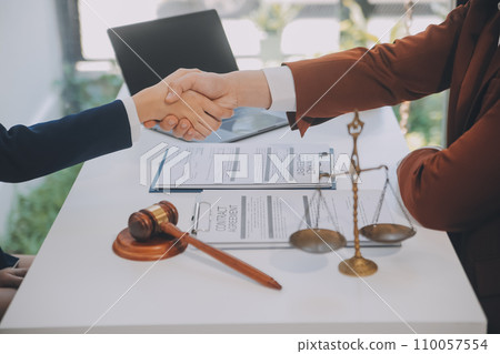 Lawyer, legal advisor, businessman brainstorming information on agreement details Business contracts in legal processing books for accuracy in contract documents. joint financial investment. 110057554