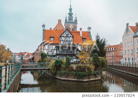 View from the front of the Millers' Guild house and the Radunia Canal in Gdansk, Poland on a blue sky summer day 110057824