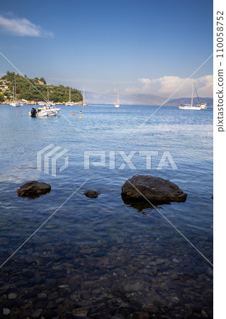 Clean sea at the bay, Kalami, Corfu, Greece 110058752