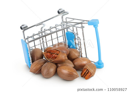 Shopping cart with pecan nut isolated on white background with full depth of field 110058927