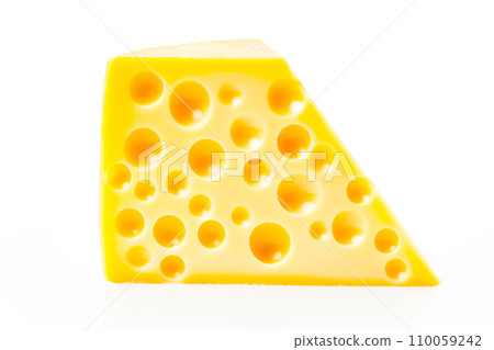 A closeup of cheese with holes like maasdam, emmental or cheddar as background 110059242
