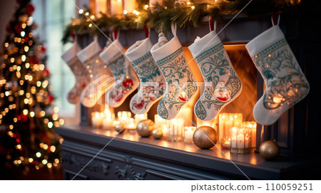 Christmas stockings hang from a fireplace mantel with candles. Winter festive atmosphere background Christmas stockings hang from a fireplace mantel with candles. Winter festive atmosphere background 110059251