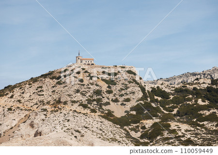 Beautiful building stands high on a cliff near Marseille. 110059449