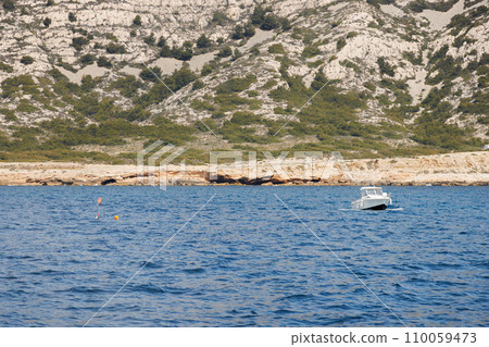 Fishing boat and underwater diver near the shore. Fishing boat and underwater diver near the shore. 110059473