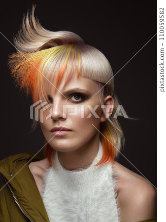 Beautiful woman with multi-colored hair and creative make up and hairstyle. Beauty face. Beautiful woman with multi-colored hair and creative make up and hairstyle. Beauty face. 110059582