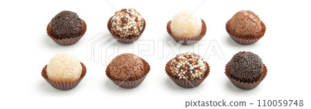 Typical Brazilian sweet brigadeiro. Assorted flavors of candies on a white background Typical Brazilian sweet brigadeiro. Assorted flavors of candies on a white background 110059748
