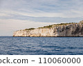 Island in the sea with high cliffs. 110060000