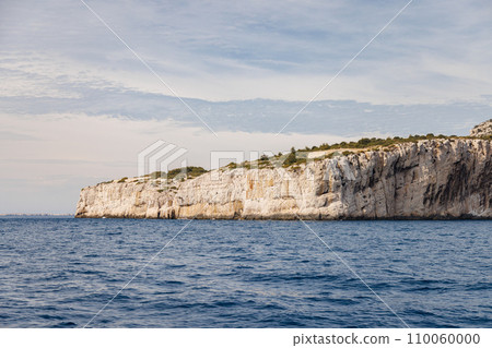 Island in the sea with high cliffs. 110060000