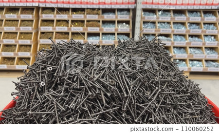 Black self-tapping screws in the store on the counter. Black self-tapping screws in the store on the counter. 110060252