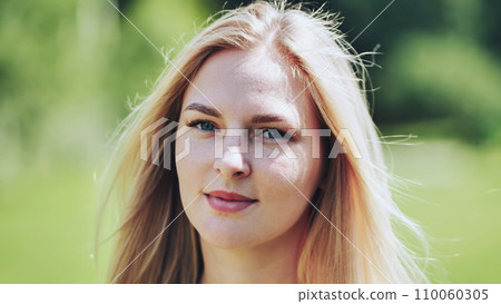 Portrait of a blonde girl of Slavic appearance. Close-up face. Portrait of a blonde girl of Slavic appearance. Close-up face. 110060305