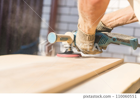 Grinding of an oak board with an angle grinder 110060551