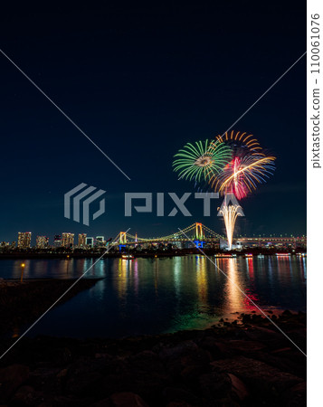Illuminated Rainbow Bridge and winter fireworks display 110061076