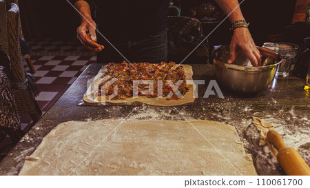 Preparing an empanada 110061700