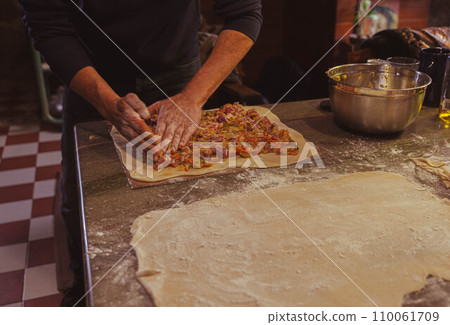 Preparing an empanada 110061709