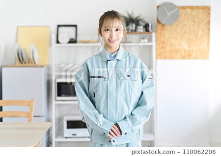 A professional woman wearing work clothes comes to your home 110062208