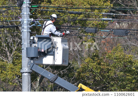 Construction site, telecommunications work, high-altitude work with a bucket truck Construction site, telecommunications work, high-altitude work with a bucket truck 110062601