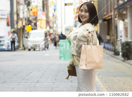 A young woman who enjoys shopping A young woman who enjoys shopping 110062682