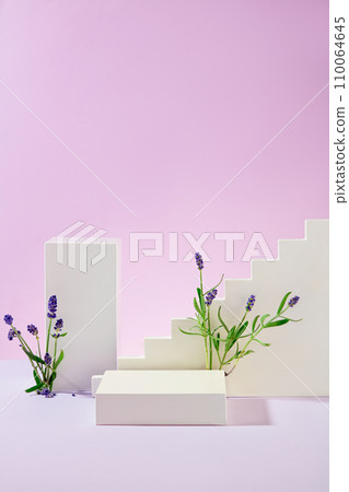 The white platforms are artistically arranged with lavender flowers on a pastel purple background. Empty space for product display. Front view. 110064645
