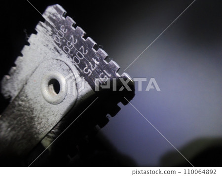 Checking film thickness with a wet gauge after painting during bridge repainting work Checking film thickness with a wet gauge after painting during bridge repainting work 110064892