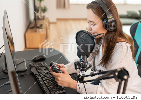 woman playing games on computer 110065192