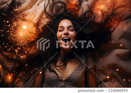 Young European woman having orgasm. Beautiful woman with open mouth and closed eyes enjoying sex lying among fireworks. Sparklers as a symbol of orgasm. Sexual experience, masturbation, cunnilingus. Young European woman having orgasm. Beautiful woman with open mouth and closed eyes enjoying sex lying among fireworks. Sparklers as a symbol of orgasm. Sexual experience, masturbation, cunnilingus. 110066643
