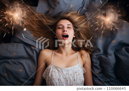 Young European woman having orgasm. Beautiful woman with open mouth and closed eyes enjoying sex lying among fireworks. Sparklers as a symbol of orgasm. Sexual experience, masturbation, cunnilingus. Young European woman having orgasm. Beautiful woman with open mouth and closed eyes enjoying sex lying among fireworks. Sparklers as a symbol of orgasm. Sexual experience, masturbation, cunnilingus. 110066645