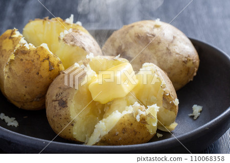 Potato butter, steaming potatoes, melting butter 110068358