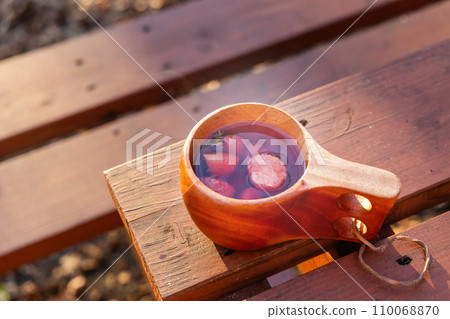 Warm fruit tea to enjoy outdoors Warm fruit tea to enjoy outdoors 110068870