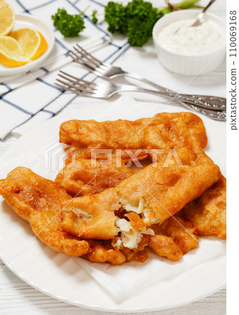 deep fried crispy beer batter fish fillet on plate deep fried crispy beer batter fish fillet on plate 110069168