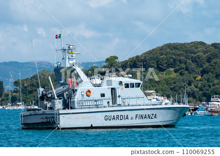Italy, Portovenere, Finance Guard boat patrolling the harbor 110069255
