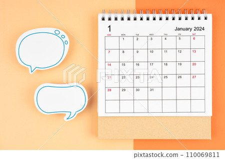 January 2024 desk calendar and empty speech bubble for your text. January 2024 desk calendar and empty speech bubble for your text. 110069811