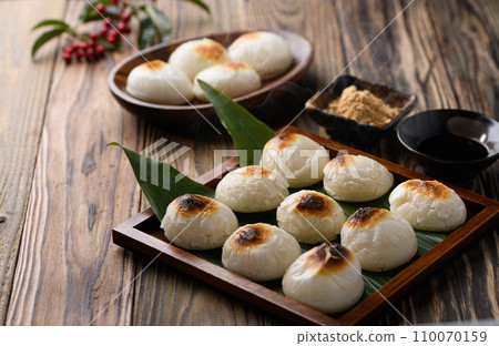 Freshly baked round mochi 110070159