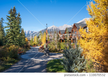 Walking trail in residential area. Town of Canmore street view in fall season. Alberta, Canada. Walking trail in residential area. Town of Canmore street view in fall season. Alberta, Canada. 110070532