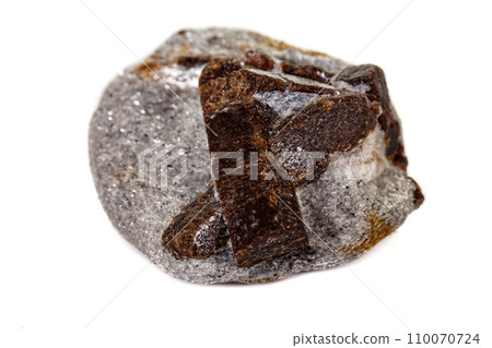 macro mineral stone Staurolite on a white background 110070724