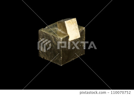 Macro mineral stone Pyrite on a black background 110070752