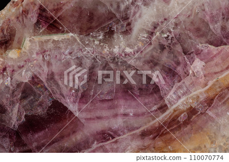 Macro stone mineral Fluorite on a black background 110070774