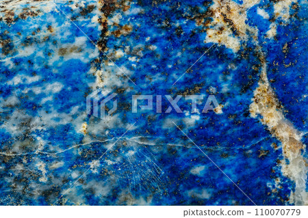 Macro of mineral stone Lazurite on a black background 110070779