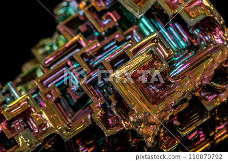 Macro of the stone bismuth mineral on a black background Macro of the stone bismuth mineral on a black background 110070792