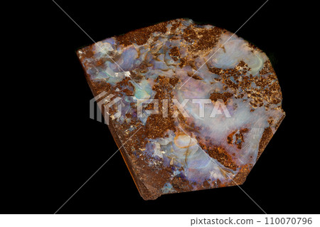 Macro stone Opal mineral in rock on a black background Macro stone Opal mineral in rock on a black background 110070796