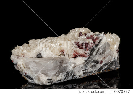 Macro stone Cinnabar dolomite mineral on a black background Macro stone Cinnabar dolomite mineral on a black background 110070837