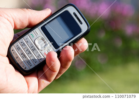 Old push-button cell phone Old push-button cell phone 110071079