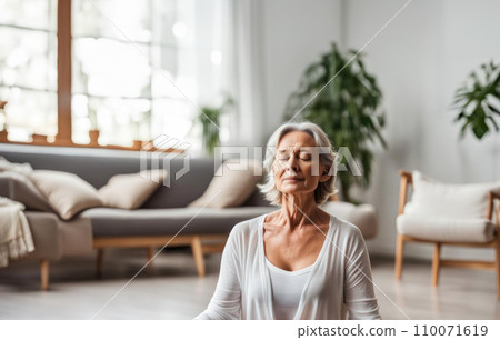 Close up portrait of adult woman in relaxing meditating feeling zen-like on fitness. Healthy active lifestyle Close up portrait of adult woman in relaxing meditating feeling zen-like on fitness. Healthy active lifestyle 110071619