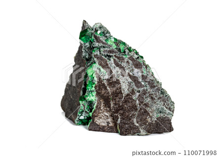 Macro stone garnet mineral, Uvarovite in rock on a white background Macro stone garnet mineral, Uvarovite in rock on a white background 110071998