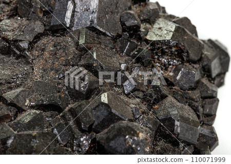 Macro stone mineral Melanite on a white background Macro stone mineral Melanite on a white background 110071999