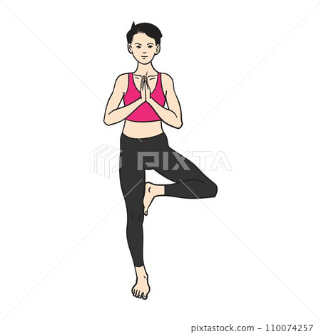 Woman standing in tree pose (vrksasana) yoga position 110074257