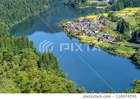 Tadami Line train and Oshi village in autumn sunny Kaneyama Town, Fukushima Prefecture 110074295