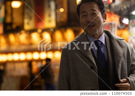 A businessman taking a detour on his way home from work 110074503