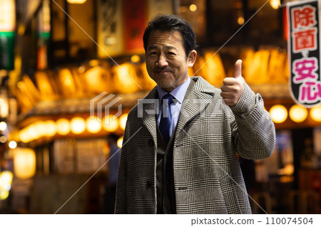 A businessman taking a detour on his way home from work 110074504