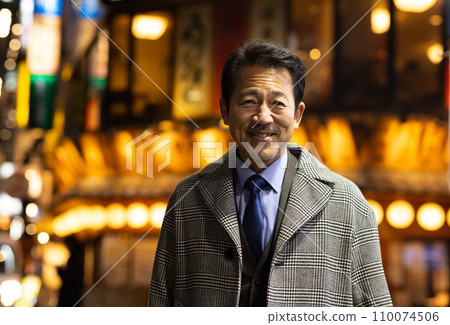 A businessman taking a detour on his way home from work 110074506