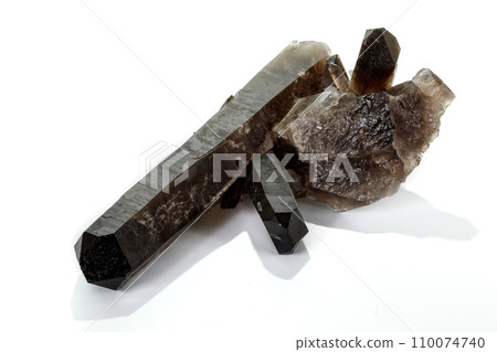 Macro mineral stone smoky quartz, rauchtopaz on a white background 110074740
